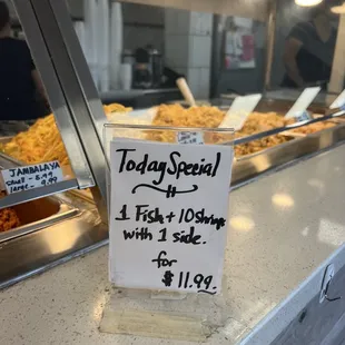 a sign on a buffet counter