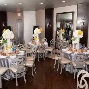 a dining room set for a wedding reception