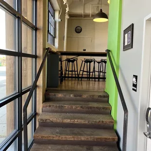 a staircase leading to a bar