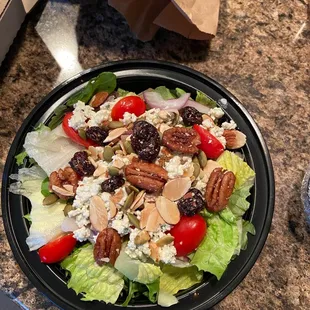 a plate of salad on a table