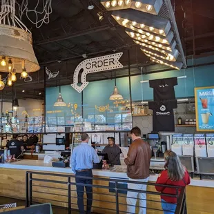 customers at the counter of a restaurant