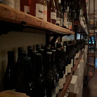 bottles of wine on shelves in a wine shop