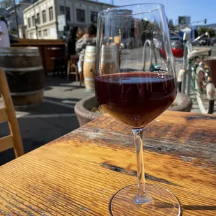 a glass of wine on a table