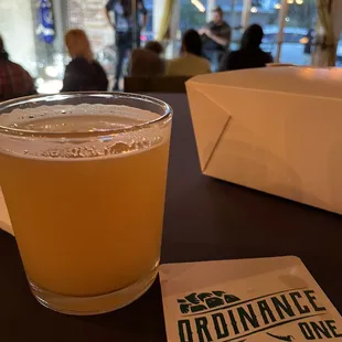 a glass of beer on a table