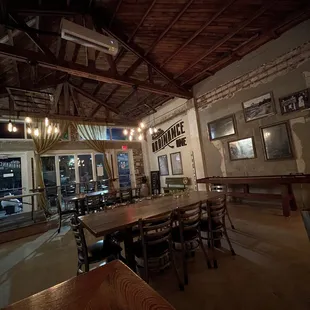 a dining room with tables and chairs