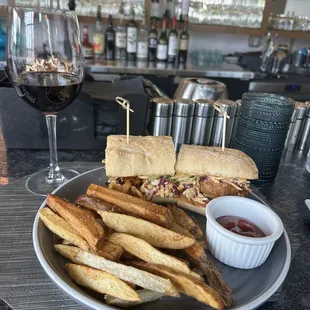 Chicken meatball banh mi sandwich and seasoned fries. Paired with a nice Malbec wine from Argentina.