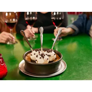 a bowl of ice cream with chocolate chips