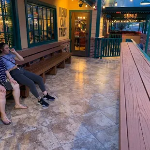 two people sitting on a bench