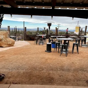 Outdoor seating with desert and mountain views.