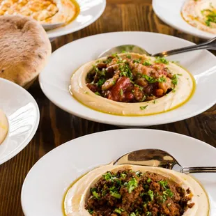 We feature Hummus Bowls with a variety of toppings available. All Bowls come with 2 warm, freshly-baked pitas!