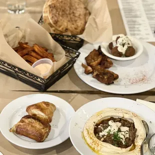 Chicken Skewer with Sweet Potato Fries and Falafel, Bourekas, and Hummus Beef