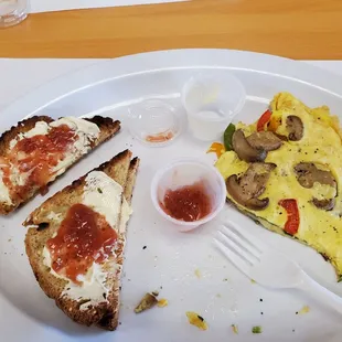 Omelet w gluten free toast. Yummy. Half gone.