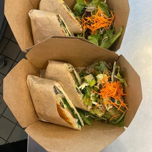 two sandwiches in paper bags