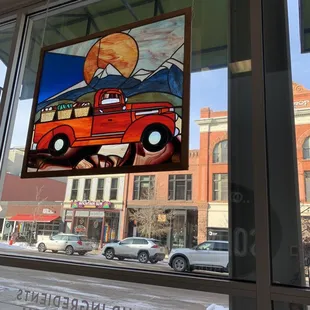 a red truck in the window