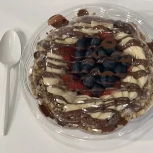 Nutella Dream Açai Base. Granola, banana, strawberry, coconut flakes and Nutella. Blueberry added.