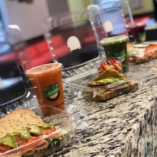 sandwiches and drinks on a counter