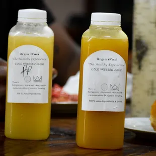 two bottles of orange juice