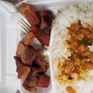 Pork chicharron with beans and rice