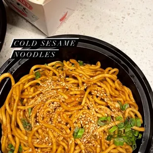 a bowl of noodles and a box of rice