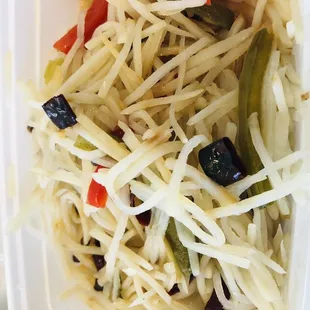 Shredded potato with vinegar and sugar. It also has a few hot peppers and Sichuan peppercorns.
