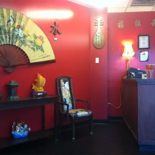 a red wall with oriental decorations