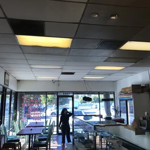 a woman standing in a restaurant