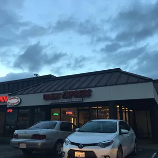 a car parked in front of a restaurant