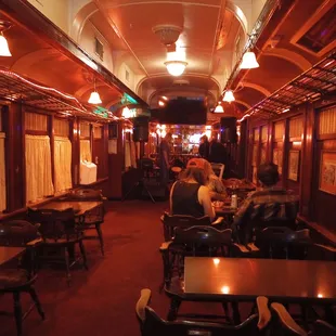 My back is to the bar, the stage is at the far end.  Note it&apos;s in an old train car!