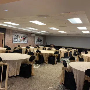 a conference room set up with tables and chairs