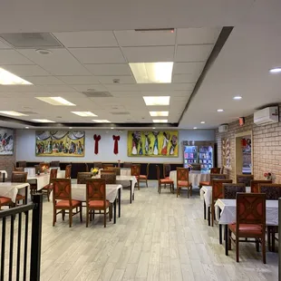 a dining area with tables and chairs