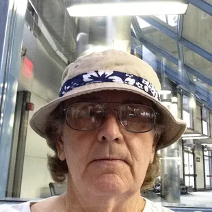 a woman wearing a hat and glasses