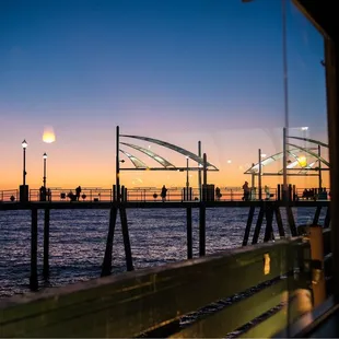 a view of a pier at dusk