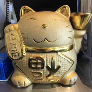 a gold cat statue