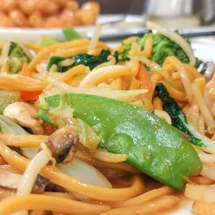a plate of noodles and vegetables