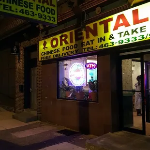 a neon sign for oriental chinese food