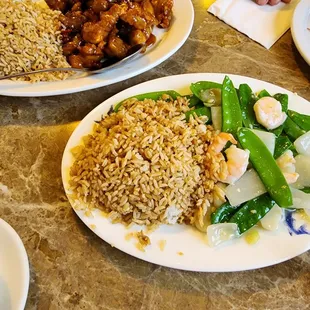 Orange chicken and peapods and shrimp   with fried rice