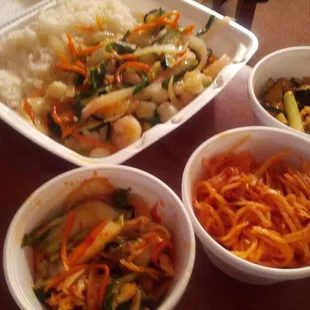 Haemul Bokkeum (seafood stir fry) and kimchi combination (Korean pickled veggie sides).