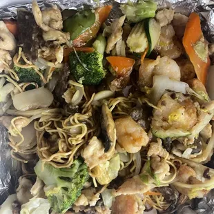 a container of noodles and vegetables