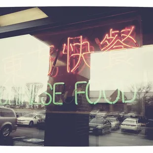 a neon sign in a window