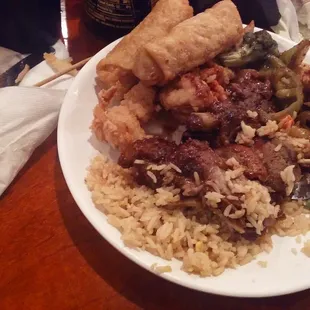 a plate of food with rice and meat