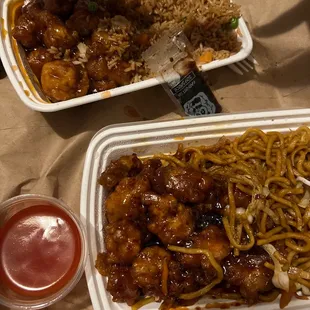 two take out containers of food