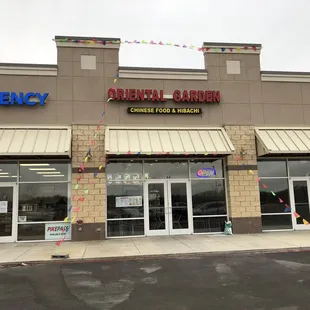 Outside look of Oriental Garden, located next to the Tag Agency and near the Wal-Mart and highway.