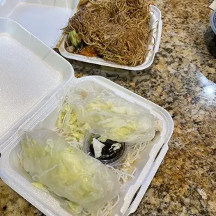 two take out containers of food