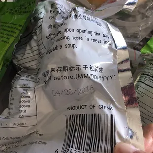 a person holding a bag of donuts