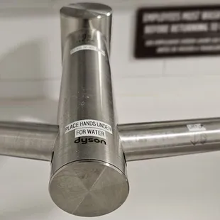 updated restroom with Dyson Wash+Dry faucet