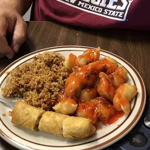 Sweet and sour pork, fried rice and egg roll.