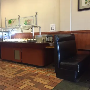 a dining area with a buffet