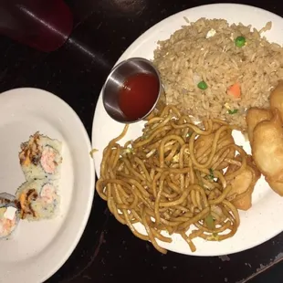 a plate of food and a bowl of sauce