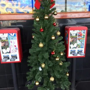 a small christmas tree with ornaments