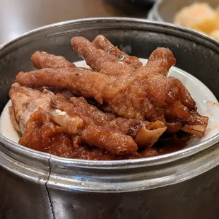 Chicken feet. Dim sum pricing as of August 2021: Small dish $4.09, medium dish $4.99, large dish $5.99.